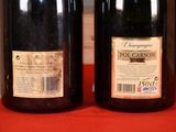 two bottles of wine that are sitting on a table