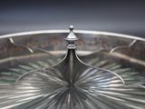 a silver plate with a flower design on it