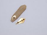 a piece of cloth and a piece of metal on a table