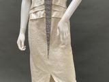 an image of a mannequin dressed in a beige dress