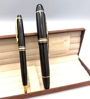 une paire de stylos à plume noirs et dorés rangés dans un coffret en bois