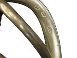 a close up of a bronze statue of a person on a bike