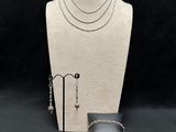 necklace, earring, ring, bracelet, and ring holder on a mannequin stand