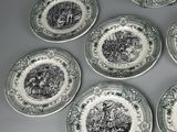 six green and white plates with black and white designs on them