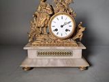 a clock that is sitting on top of a table