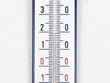 a thermometer hanging on a wall with a white background