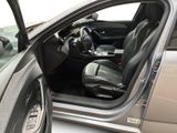 a car door open with the driver ' s seat down