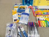 a lot of pens and pencils that are on the table