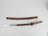 two knives are sitting on a table next to each other