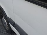 a white van parked on the side of the road