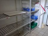 a refrigerator that has a lot of shelves in it