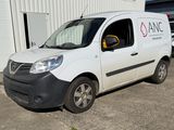 a van that is parked in front of a building