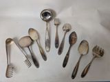 a lot of spoons and forks that are on the table