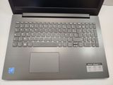 a laptop that is sitting on a table with a keyboard