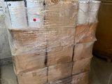 a stack of boxes sitting on a pallet in a room