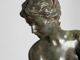 bronze statue of a woman holding a baby in her arms