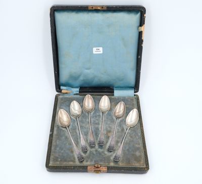silverware in a case with four spoons in it