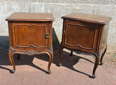 two nightstands sitting next to each other on a sidewalk