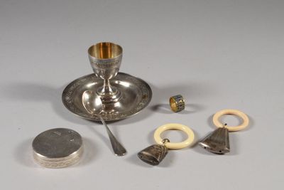 a silver plate with a spoon, spoon, and other items on it