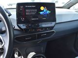 the dashboard of a car with a large screen in the center of it