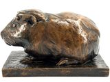 bronze sculpture of a guinea on a marble base on a white background