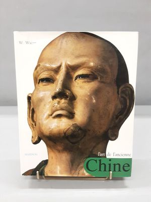 the front cover of a book with a statue of a man ' s face