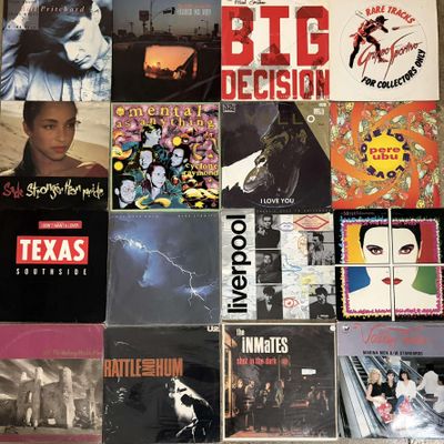 a lot of records that are on the floor