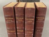 a set of four books sitting on top of each other
