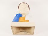 a figurine of a man sitting at a desk in a box