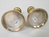 pair of antique brass candlesticks with labels on them