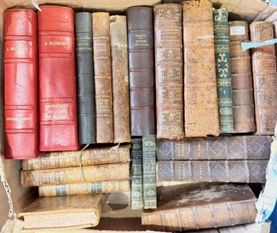 a box full of old books sitting on a table