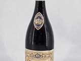 a bottle of wine that is sitting on a table