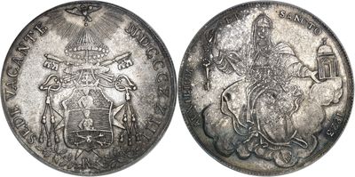 a close up of two silver coins on a white background