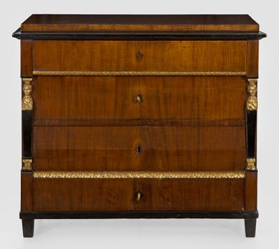 an antique wooden chest of drawers with a black top and gold trimming