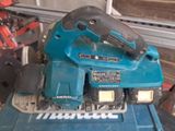 a picture of a cordless tool sitting on top of a blue box