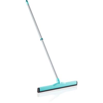 a close up of a mop on a white surface