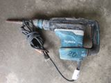 a hammer that is laying on the ground
