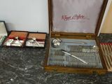 a wooden box with silverware in it on a table