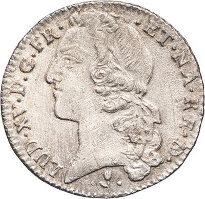 une pièce d'argent portant l'image d'une tête de femme