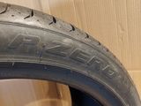 a close up of a tire on a cardboard box next to a cardboard box