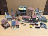 beaucoup de petits bâtiments miniatures posés sur une table