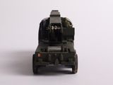 a toy army vehicle that is sitting on a white surface
