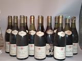 several bottles of wine are lined up on a table