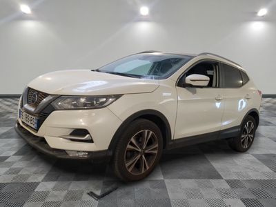 the white nissan qx - v is parked on a checkered floor