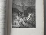 an open book with a picture of a man sitting on a rock