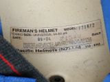 a label on the back of a jacket that says fireman ' s helmet model pk 2