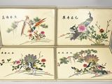 four chinese paintings of birds and flowers are displayed on a table