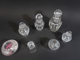 a lot of glass objects on a black surface