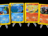 several pokemon cards are lined up in a row on a black background