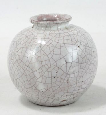 a white and pink vase with a cracky design on it